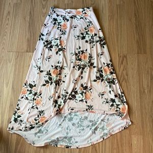 Baby pink skirt with a floral print.